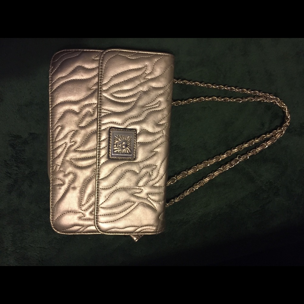Gold handbag with chain straps